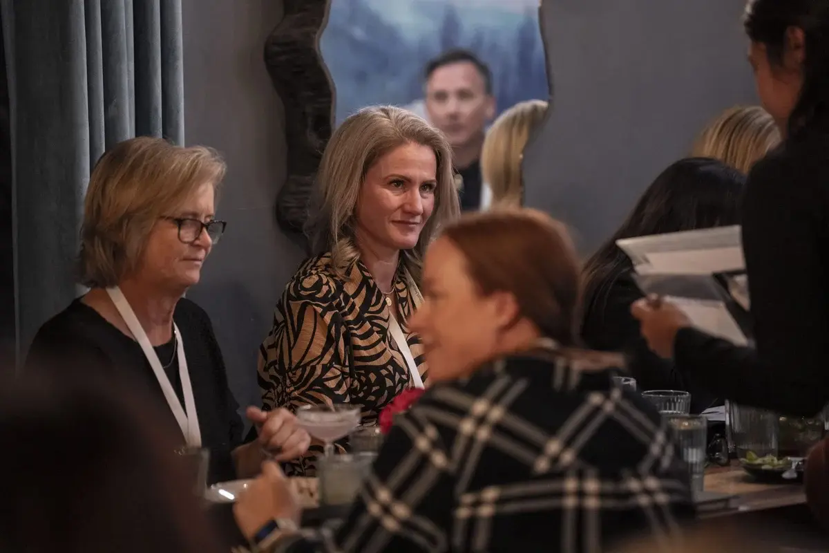 AFT Women in FinTech 2023 — two women attendees in conversation at the event
